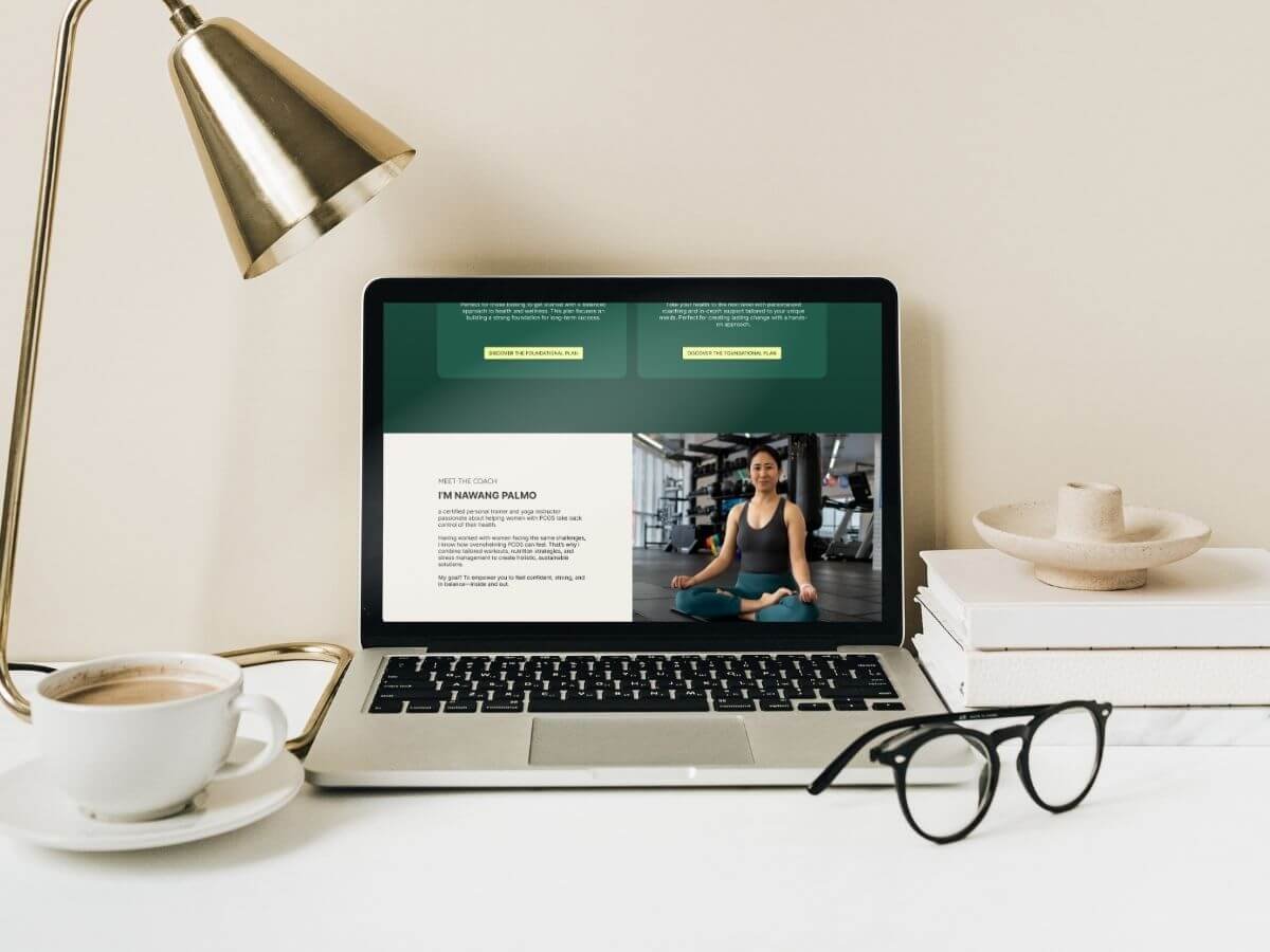 Laptop displaying Nawang's wellness brand story website, styled in an aesthetic, calming workspace setting.